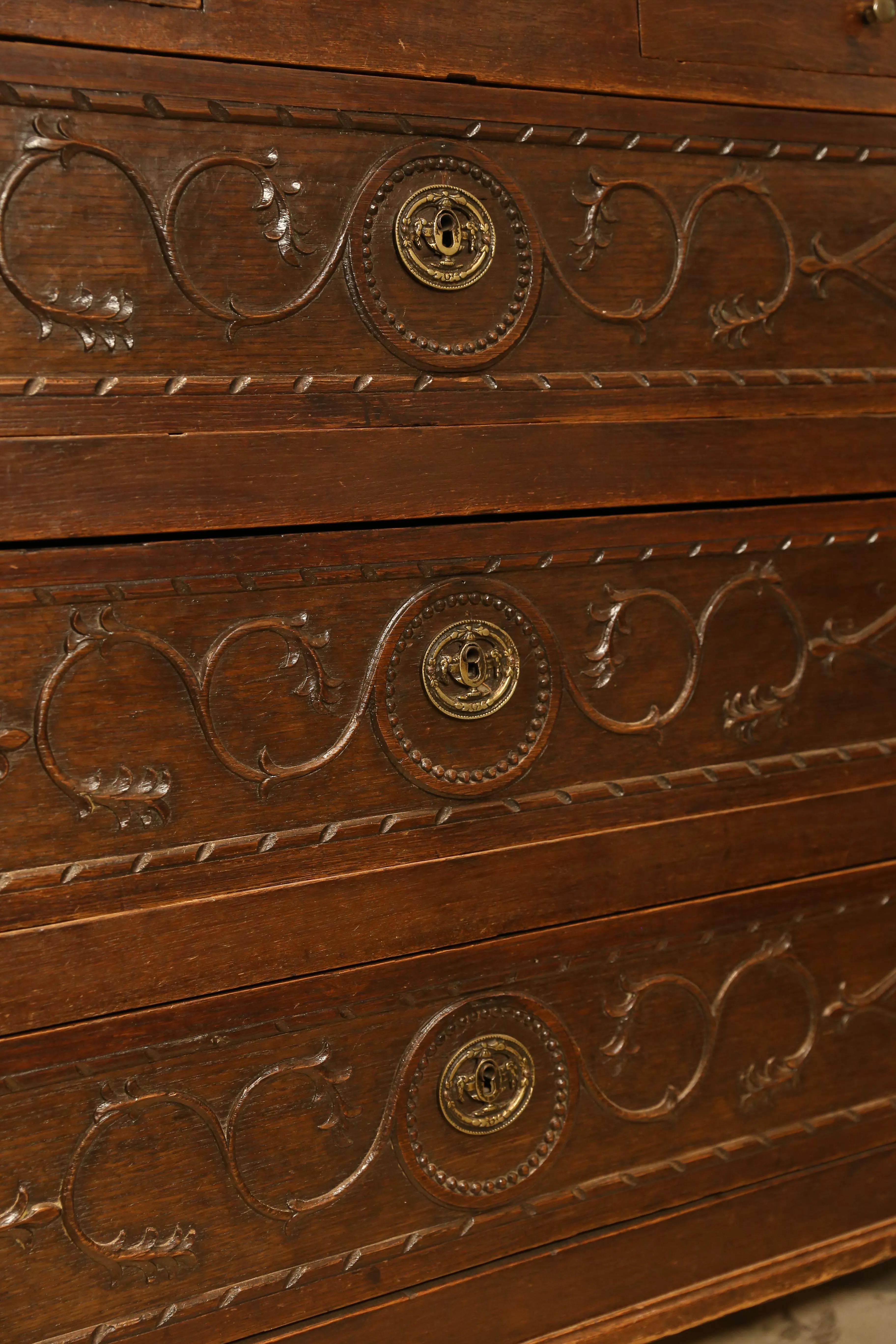 Antique French Commode with Intricately Decorated Drawer Fronts