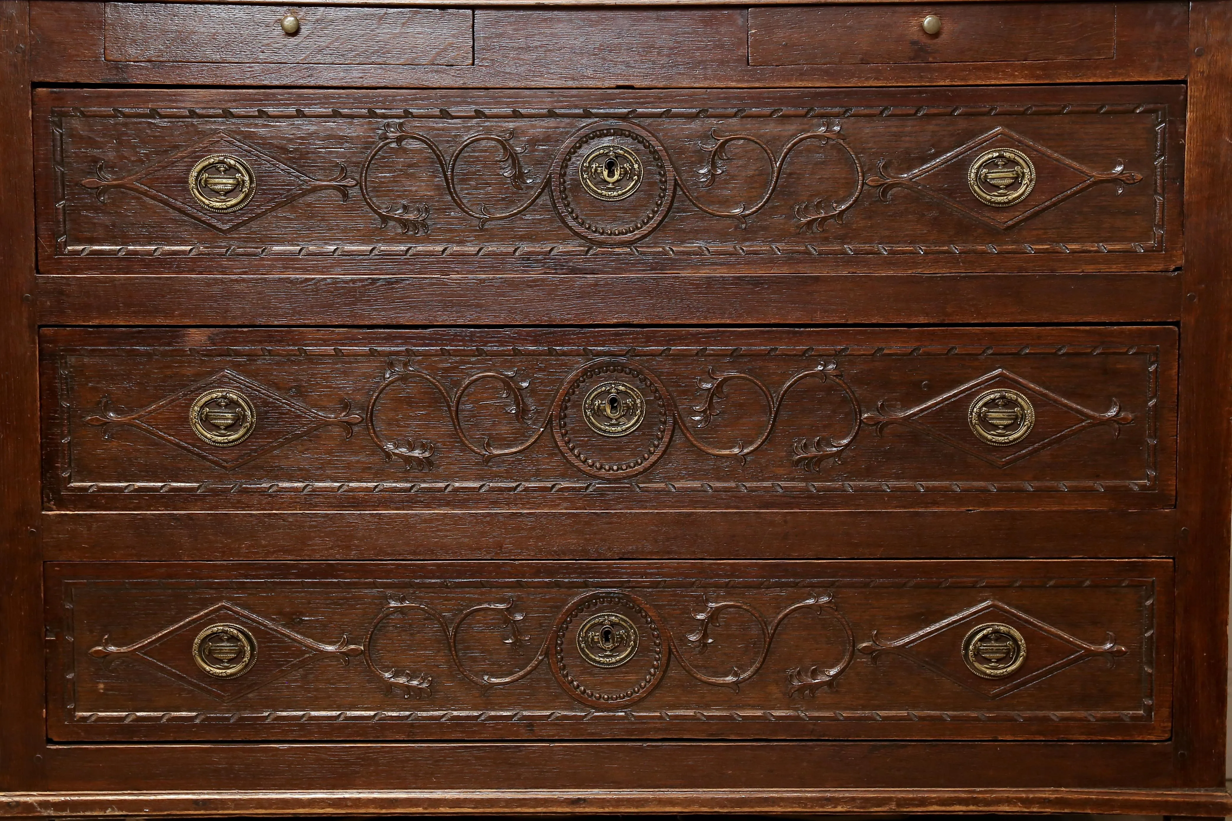 Antique French Commode with Intricately Decorated Drawer Fronts