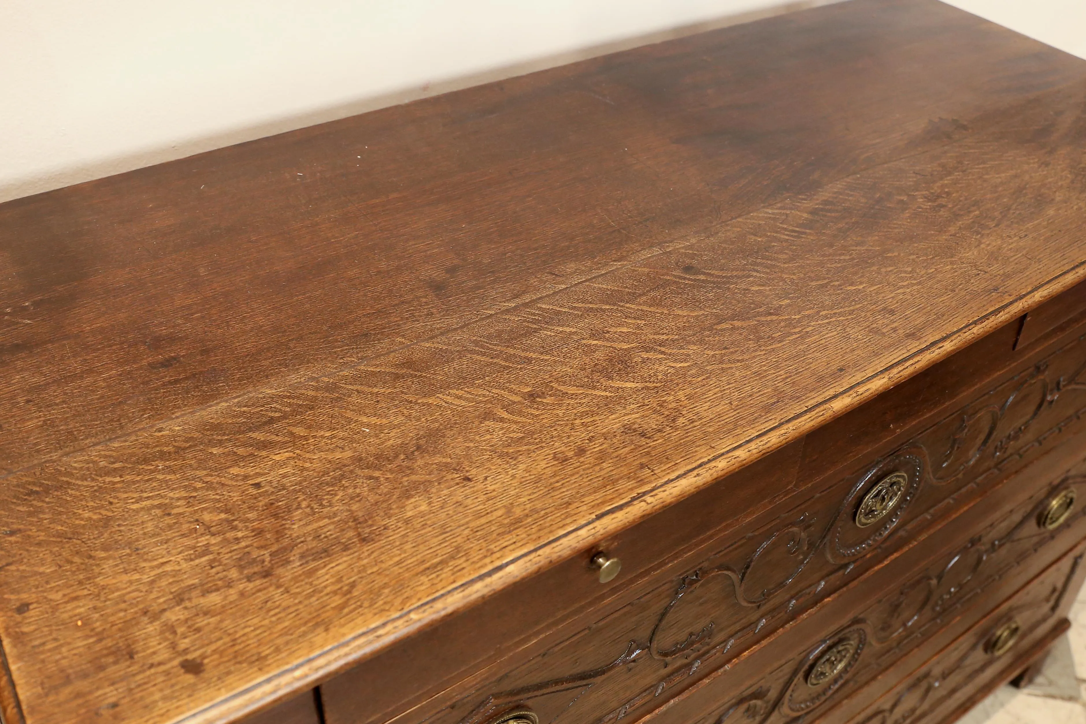 Antique French Commode with Intricately Decorated Drawer Fronts