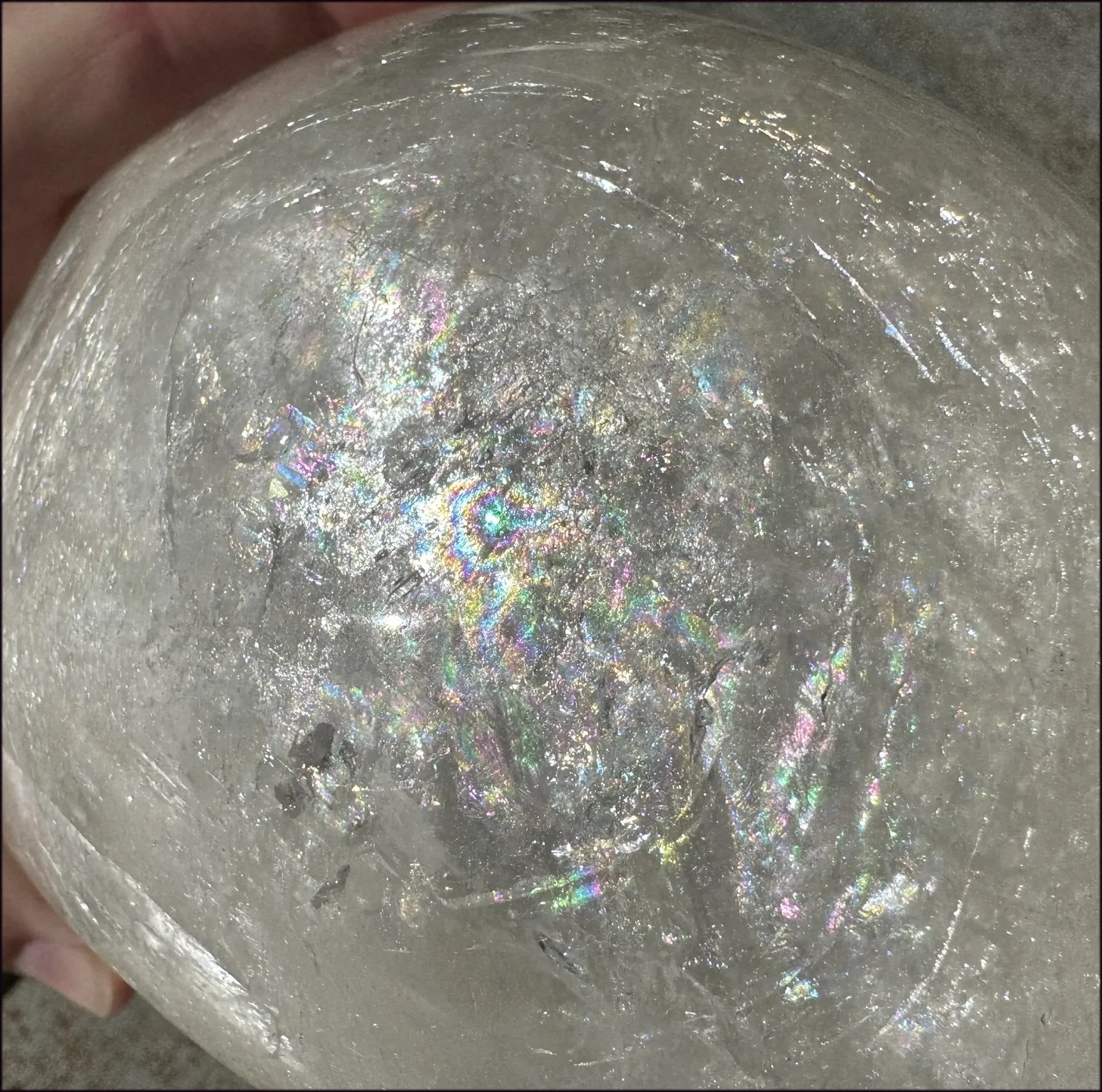 LifeSize Himalayan Quartz Crystal Skull with Crown Chakra Rainbows, Multi-Colored Hematite