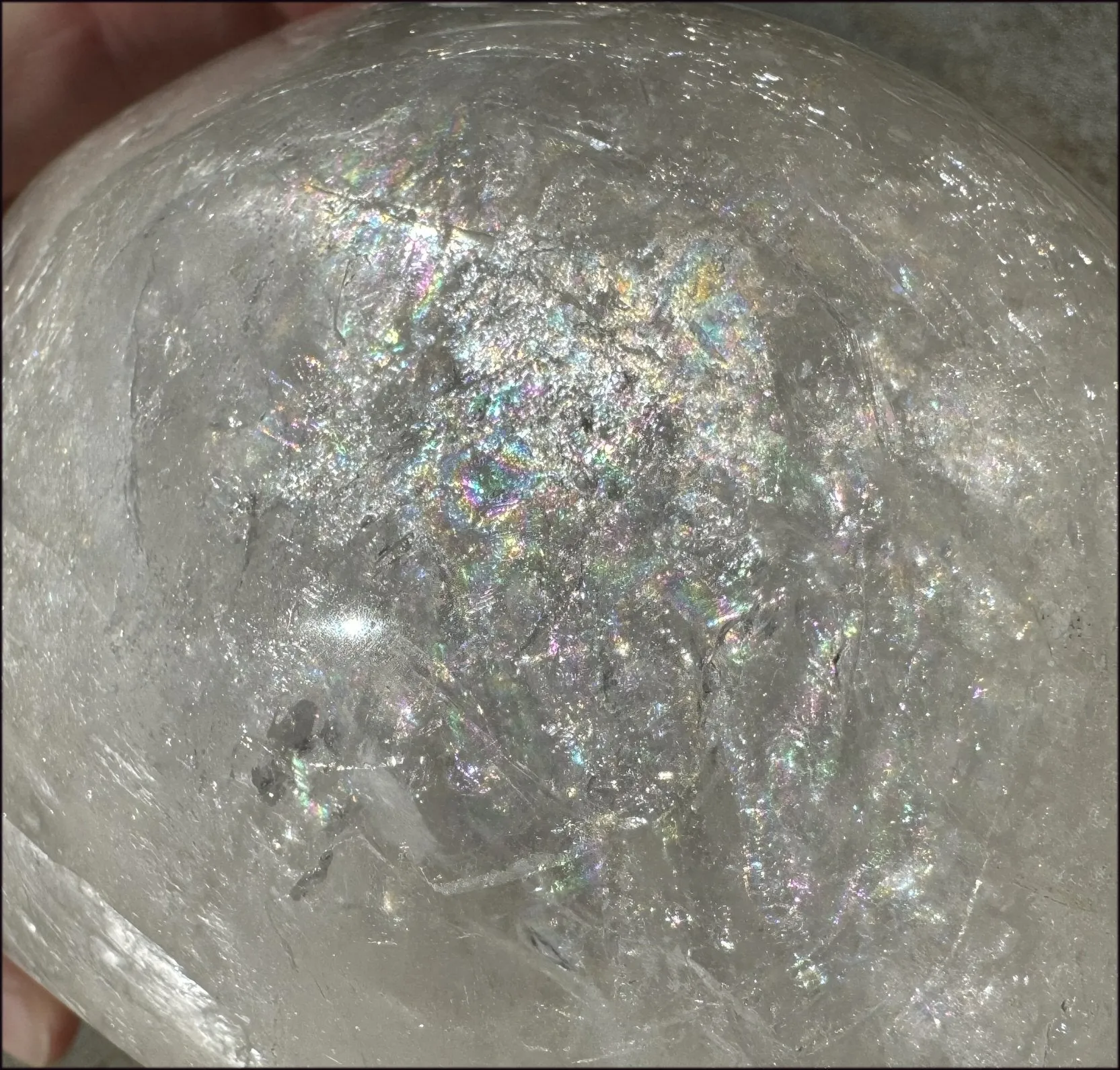 LifeSize Himalayan Quartz Crystal Skull with Crown Chakra Rainbows, Multi-Colored Hematite