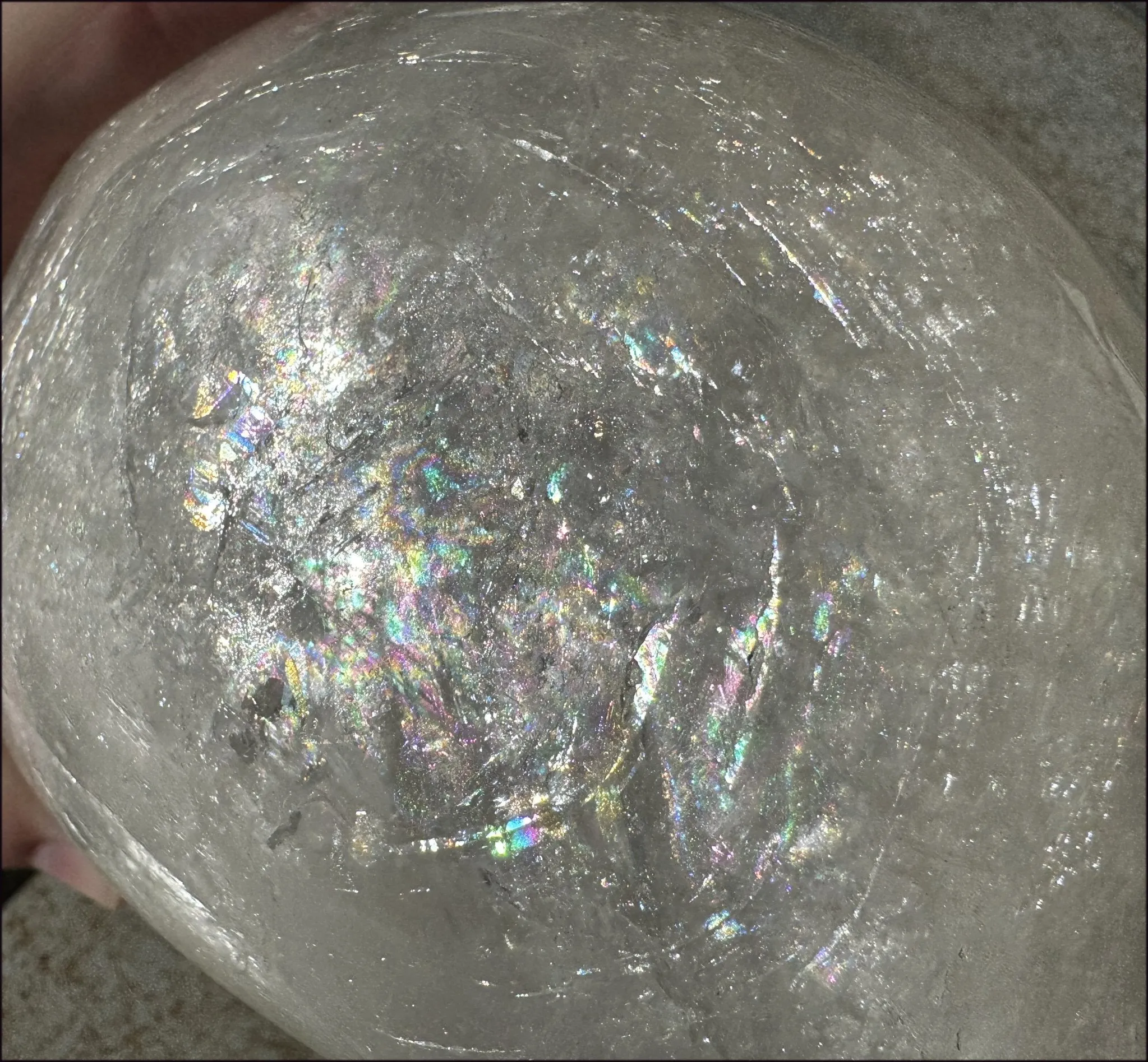 LifeSize Himalayan Quartz Crystal Skull with Crown Chakra Rainbows, Multi-Colored Hematite