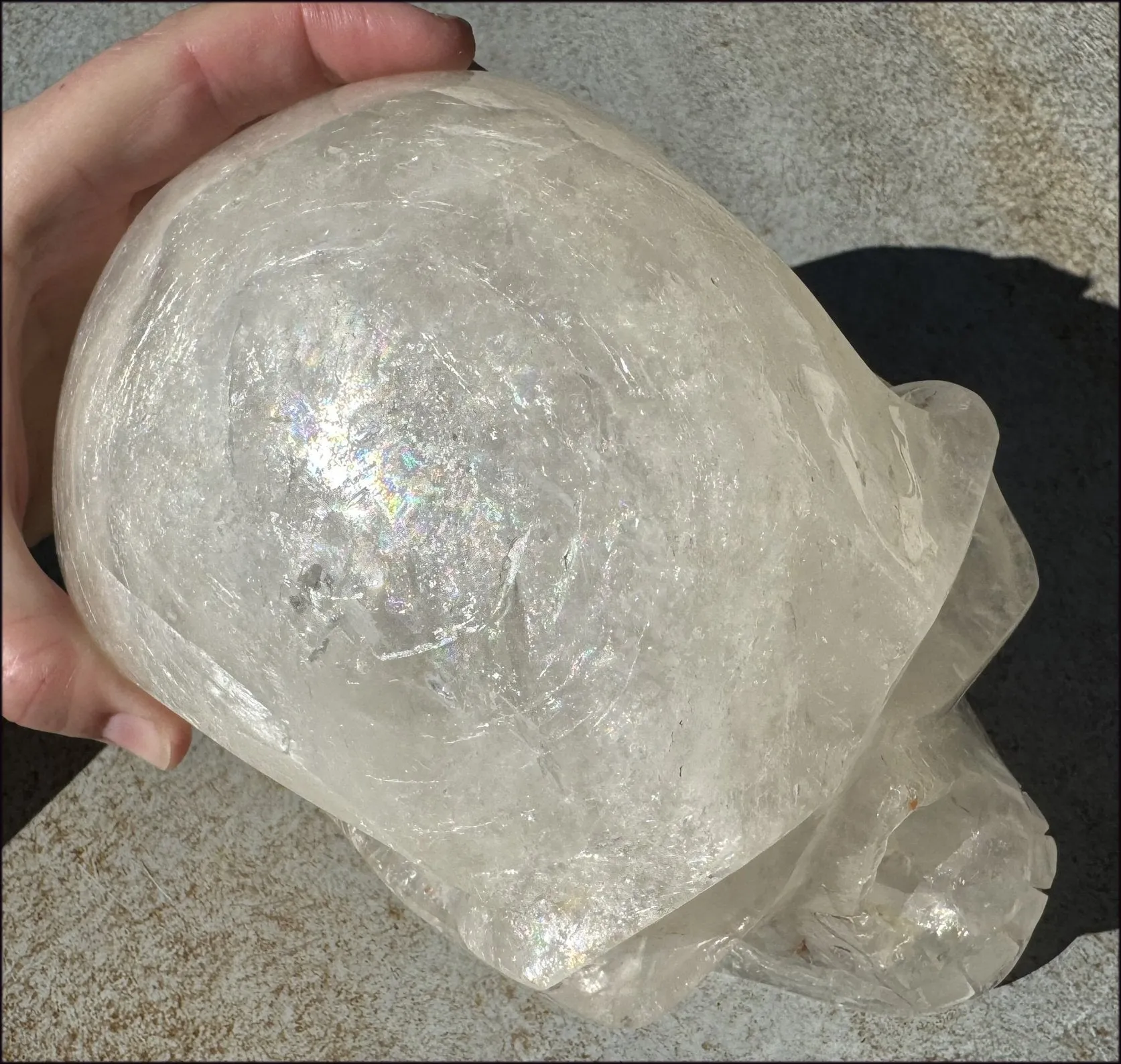 LifeSize Himalayan Quartz Crystal Skull with Crown Chakra Rainbows, Multi-Colored Hematite
