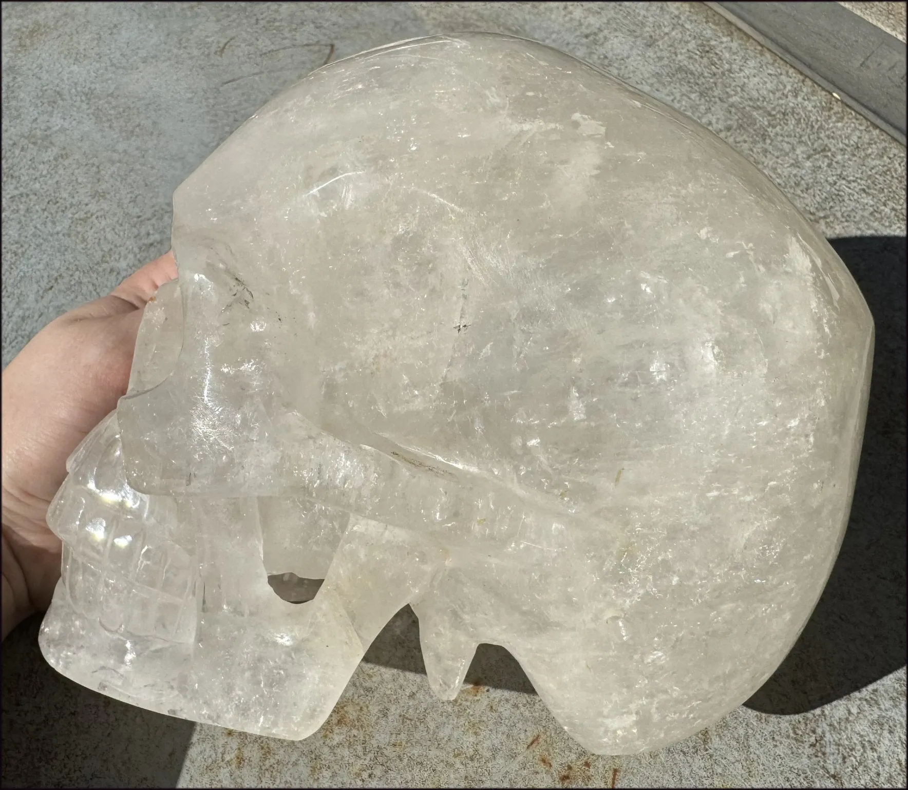 LifeSize Himalayan Quartz Crystal Skull with Crown Chakra Rainbows, Multi-Colored Hematite