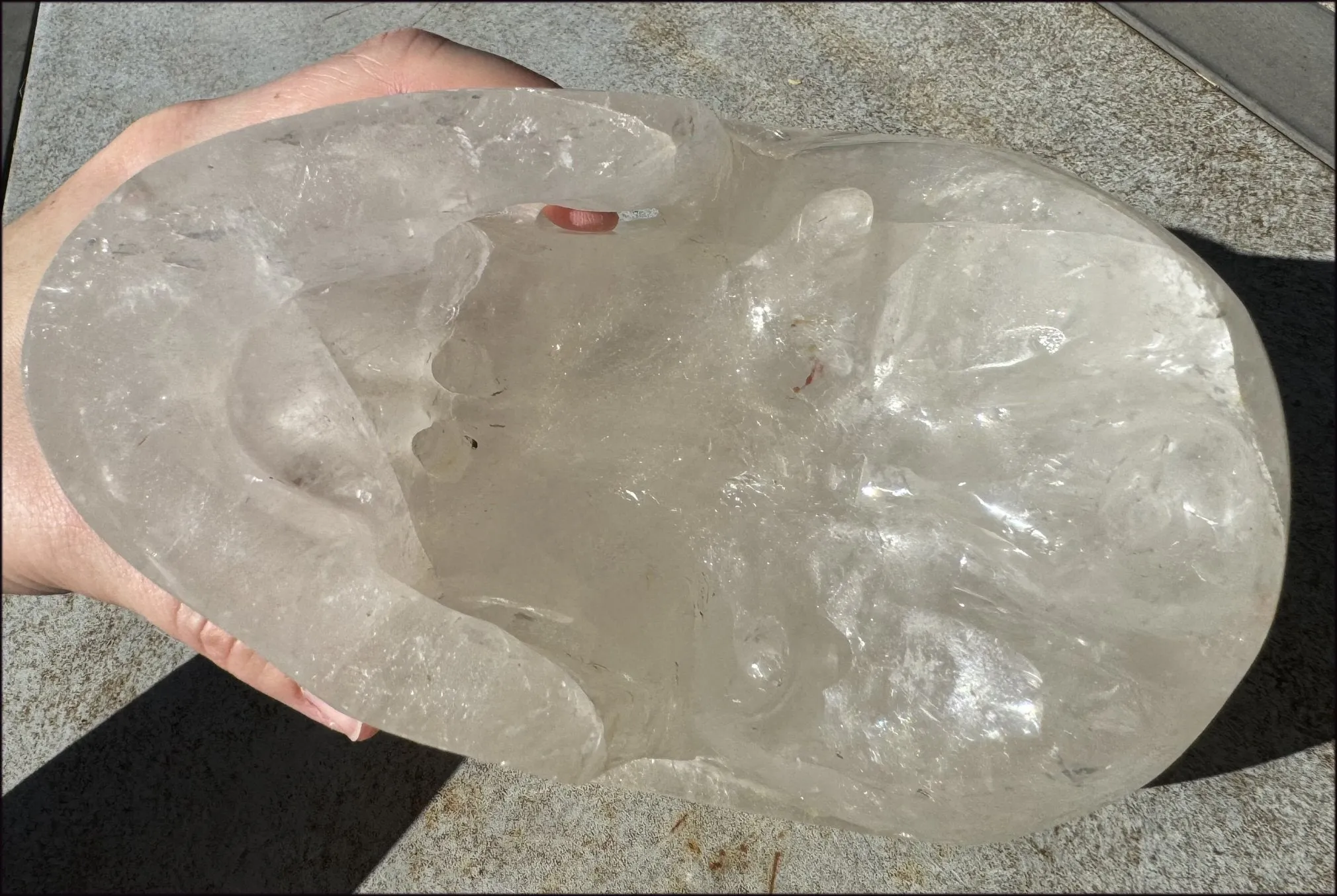 LifeSize Himalayan Quartz Crystal Skull with Crown Chakra Rainbows, Multi-Colored Hematite