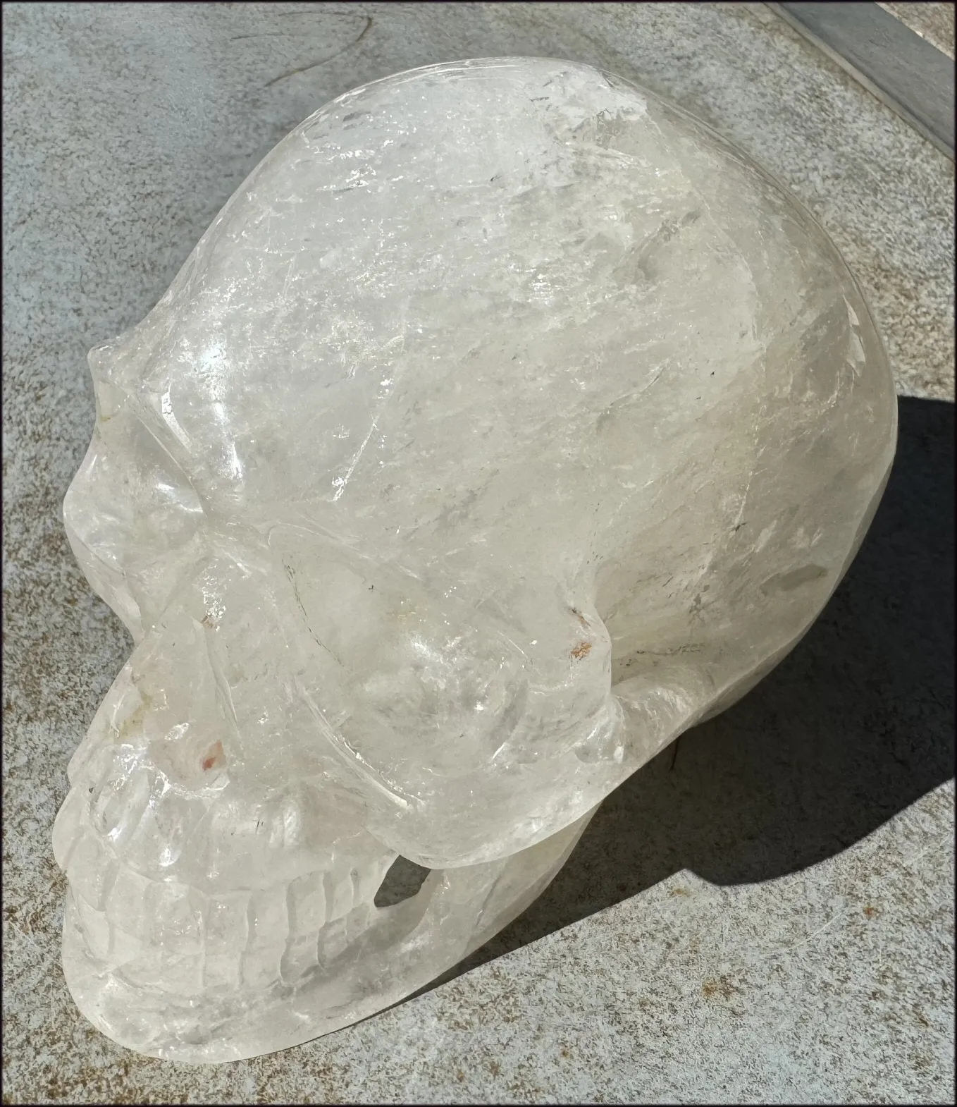 LifeSize Himalayan Quartz Crystal Skull with Crown Chakra Rainbows, Multi-Colored Hematite