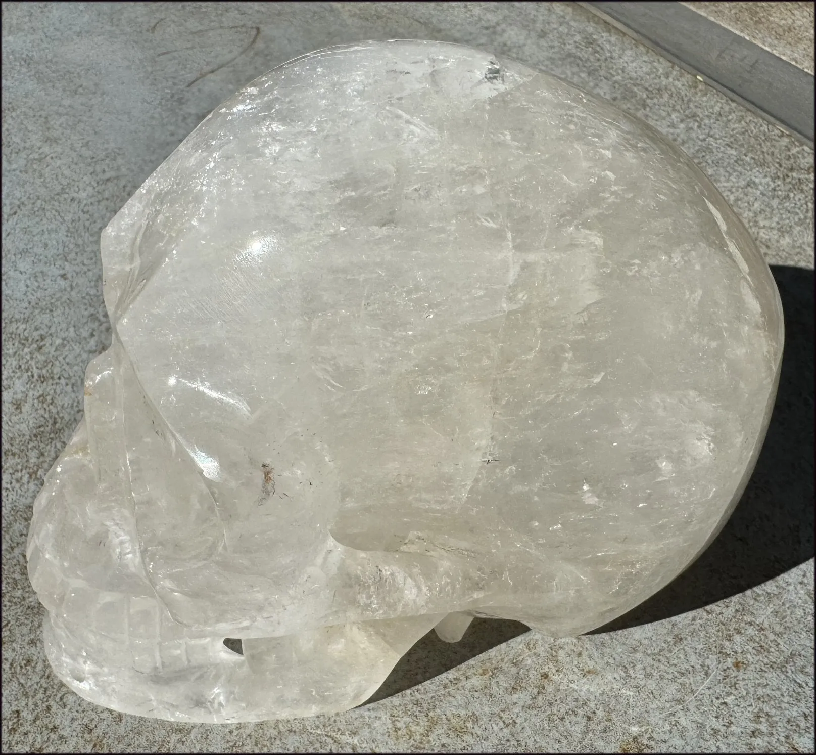 LifeSize Himalayan Quartz Crystal Skull with Crown Chakra Rainbows, Multi-Colored Hematite