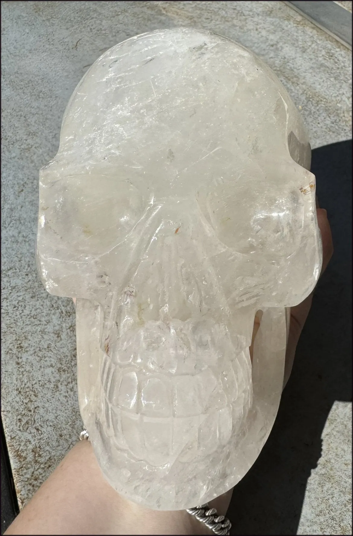 LifeSize Himalayan Quartz Crystal Skull with Crown Chakra Rainbows, Multi-Colored Hematite