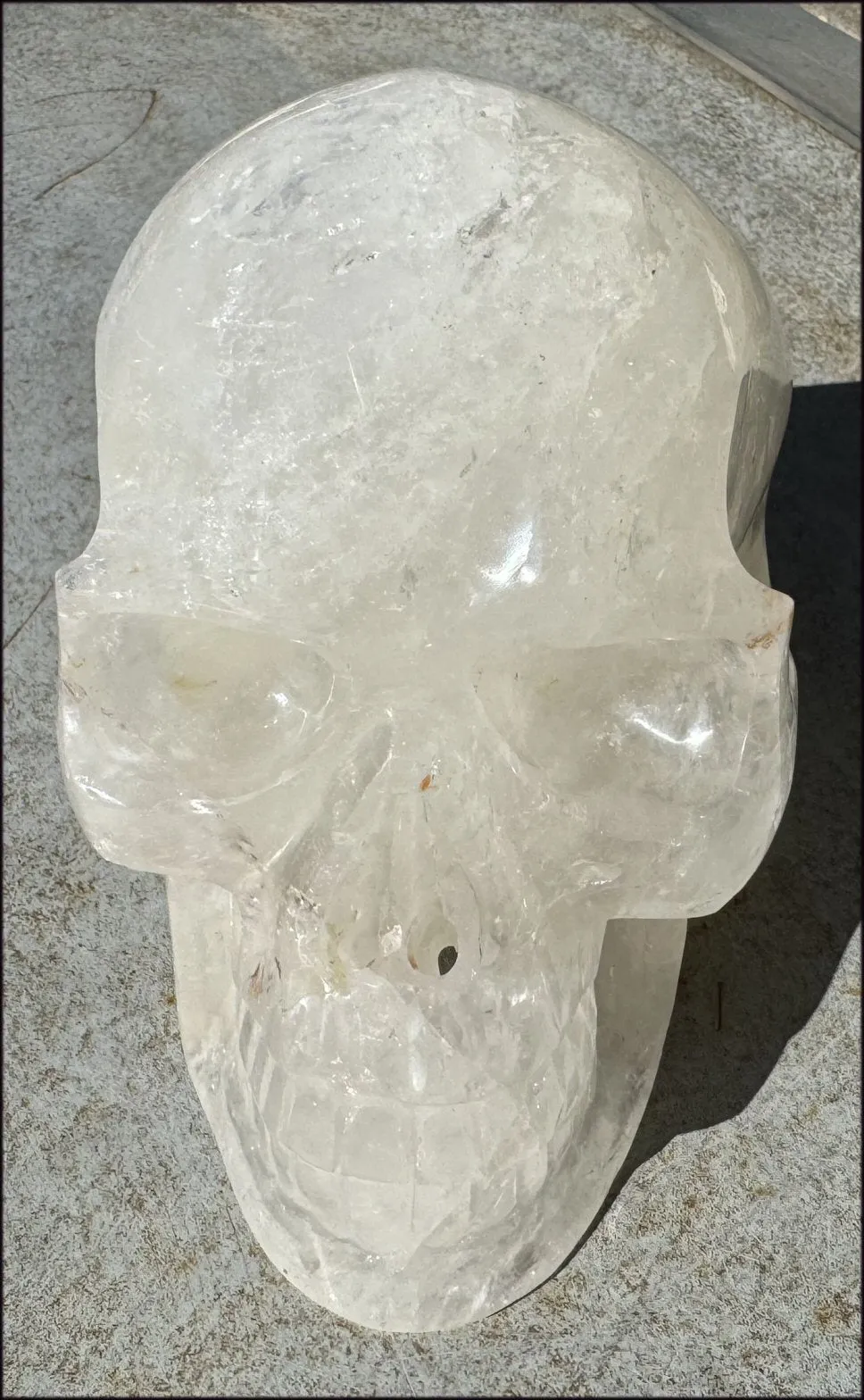 LifeSize Himalayan Quartz Crystal Skull with Crown Chakra Rainbows, Multi-Colored Hematite