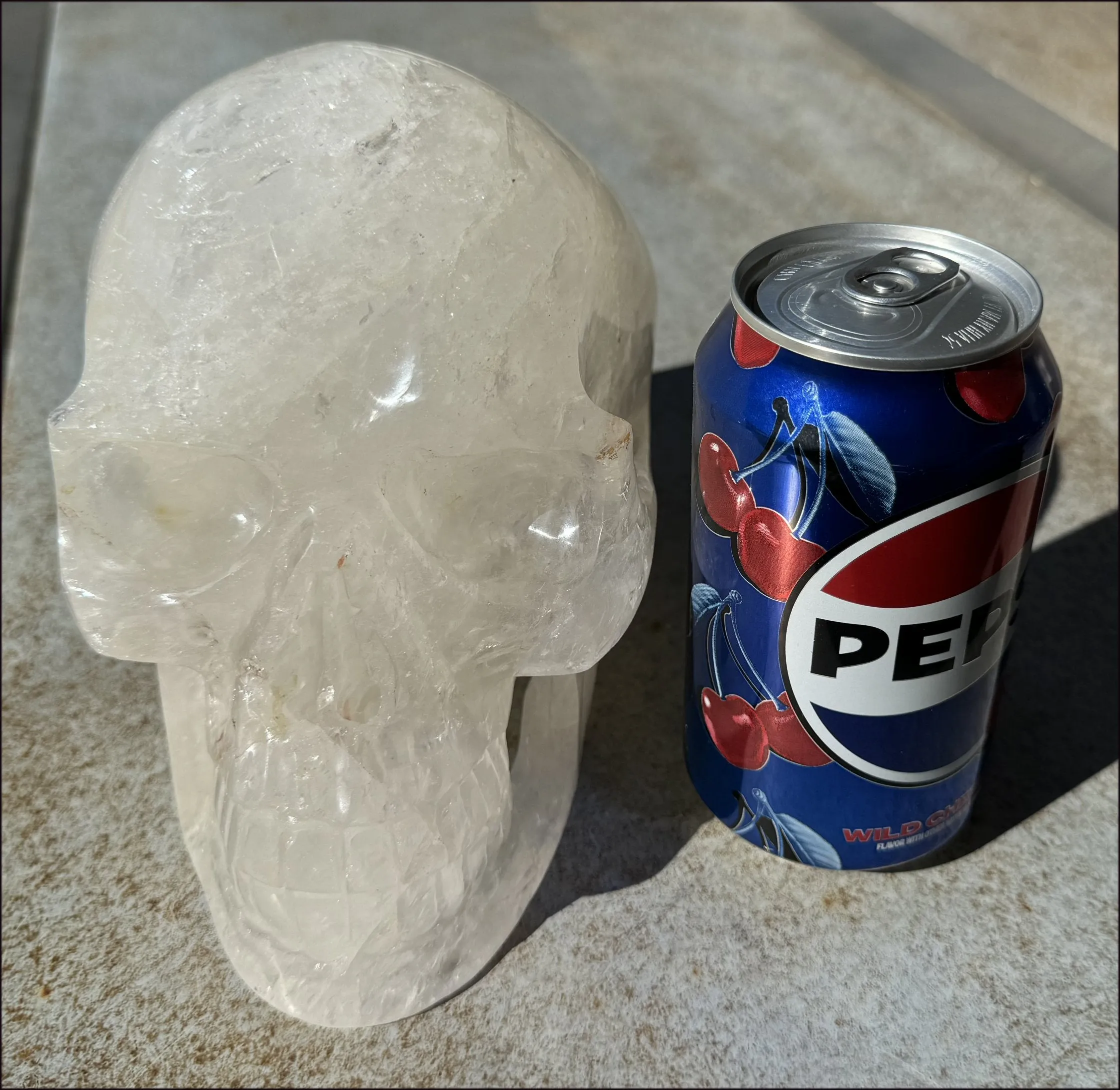 LifeSize Himalayan Quartz Crystal Skull with Crown Chakra Rainbows, Multi-Colored Hematite