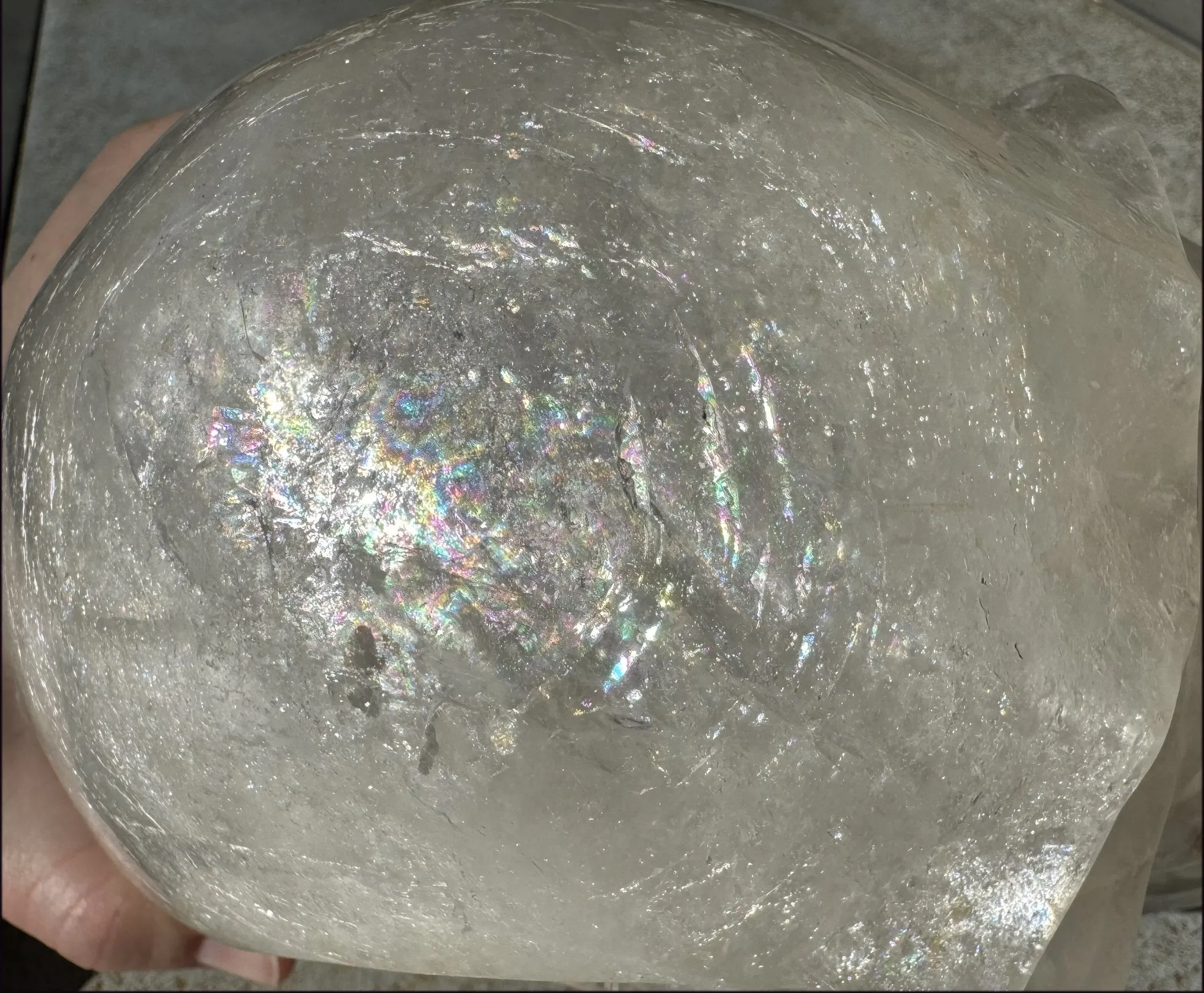 LifeSize Himalayan Quartz Crystal Skull with Crown Chakra Rainbows, Multi-Colored Hematite