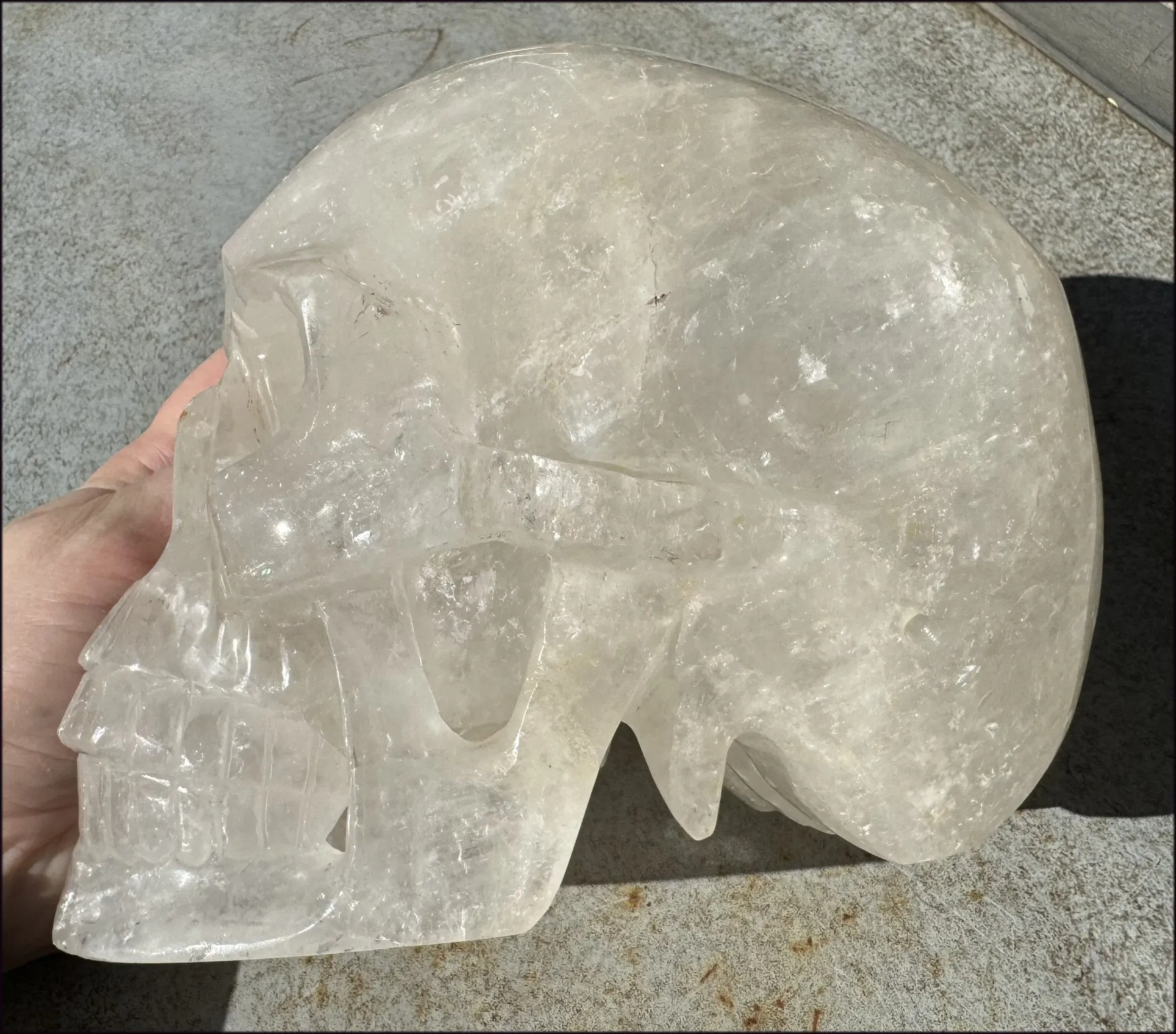 LifeSize Himalayan Quartz Crystal Skull with Crown Chakra Rainbows, Multi-Colored Hematite