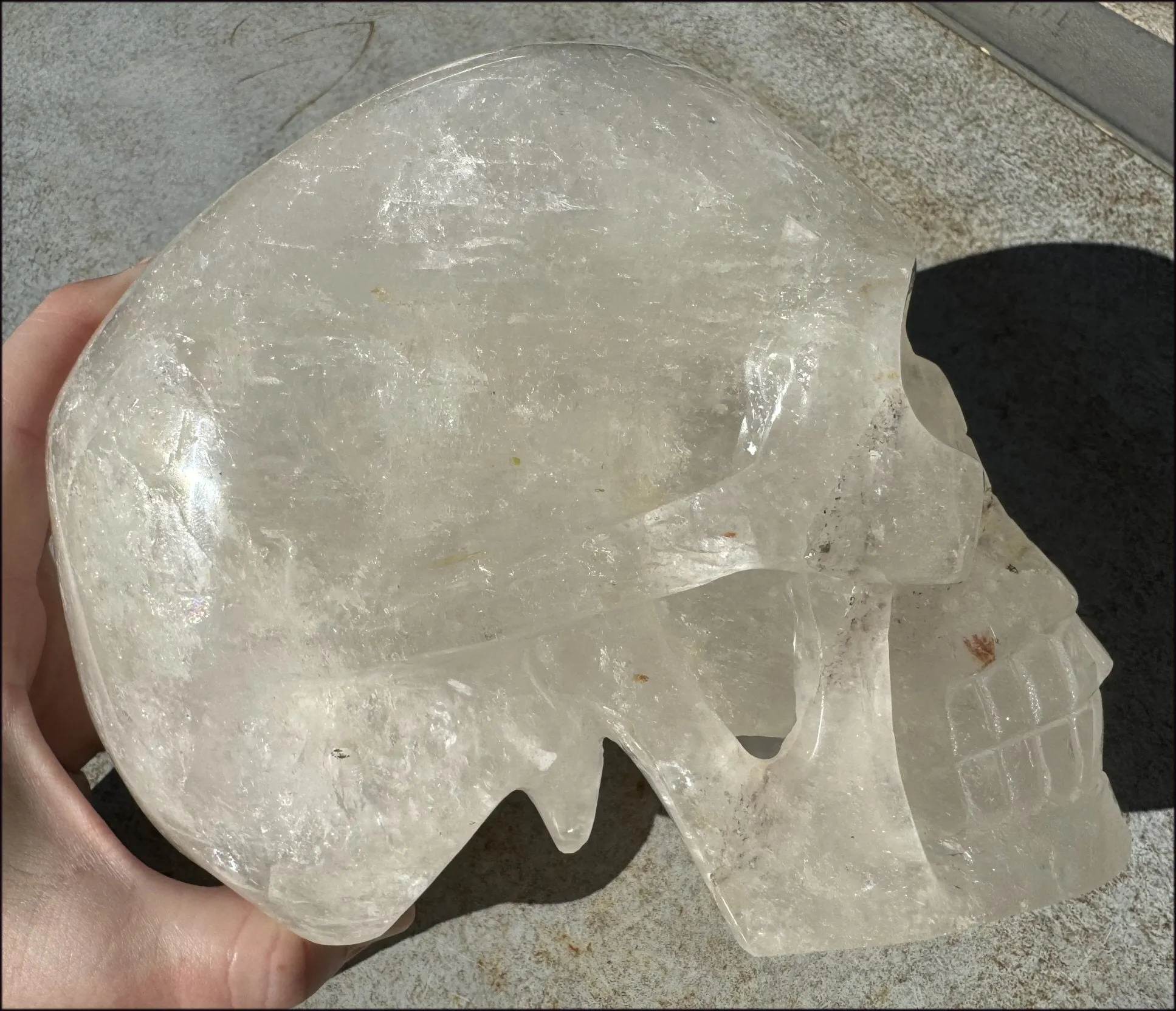 LifeSize Himalayan Quartz Crystal Skull with Crown Chakra Rainbows, Multi-Colored Hematite