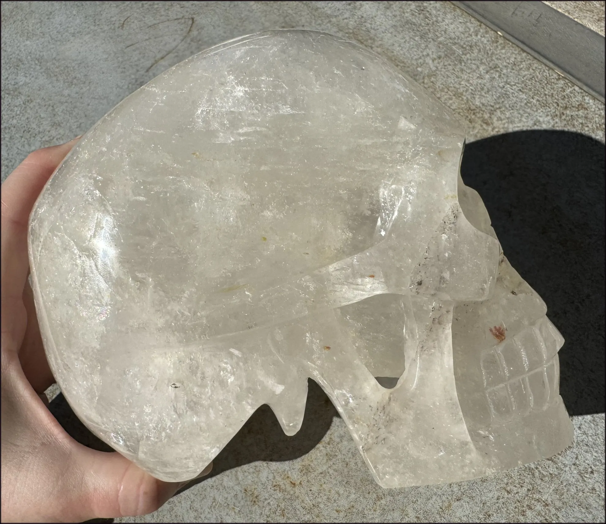 LifeSize Himalayan Quartz Crystal Skull with Crown Chakra Rainbows, Multi-Colored Hematite