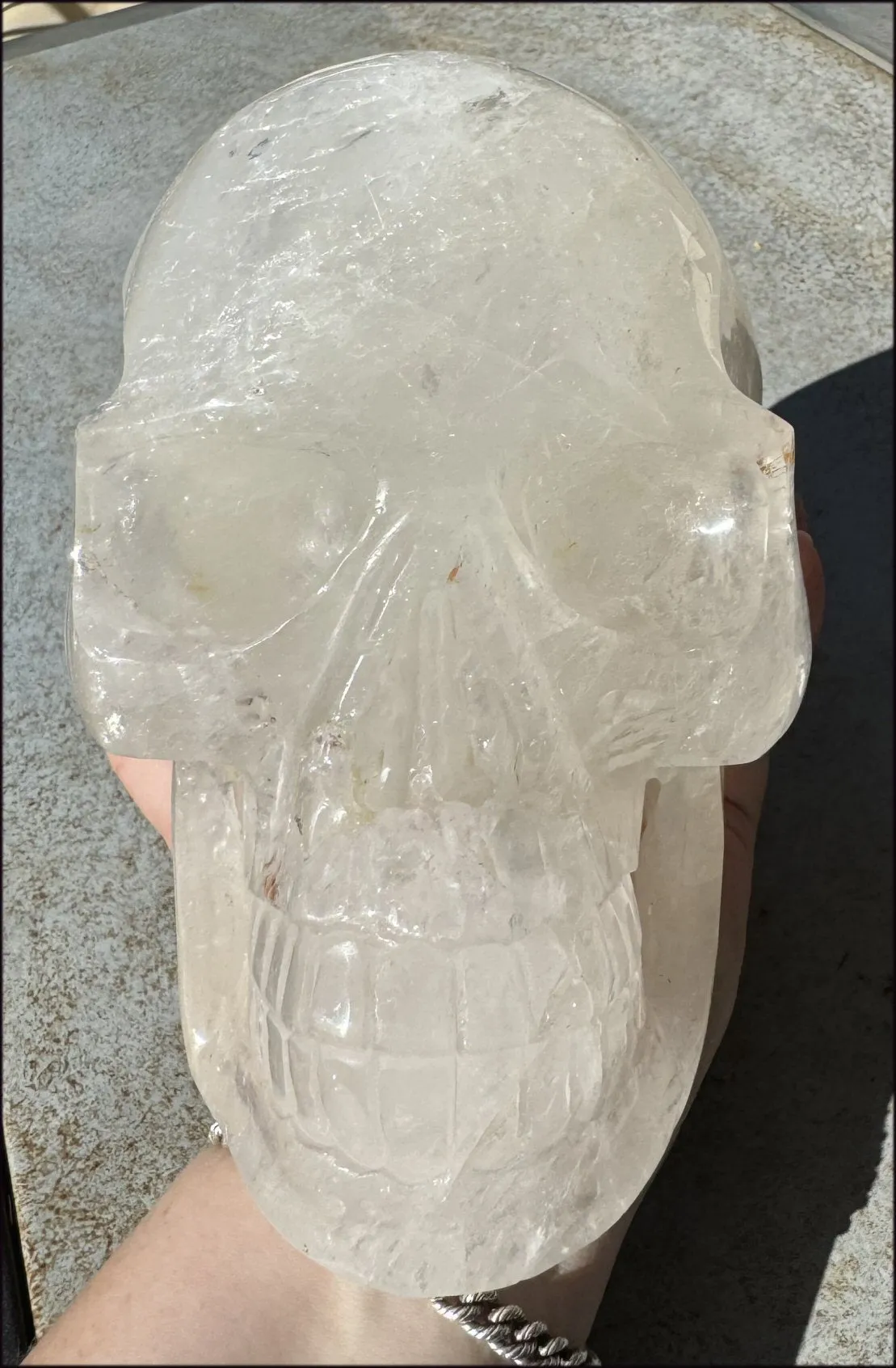 LifeSize Himalayan Quartz Crystal Skull with Crown Chakra Rainbows, Multi-Colored Hematite