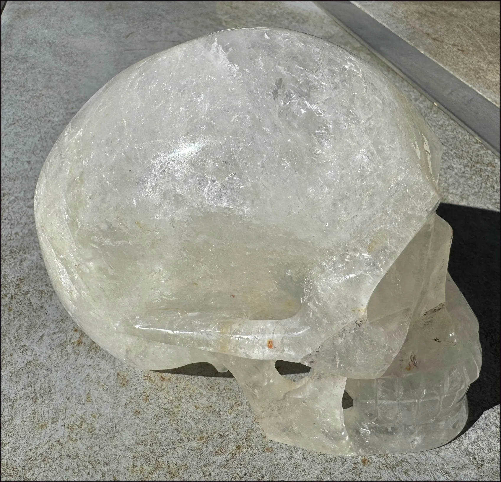 LifeSize Himalayan Quartz Crystal Skull with Crown Chakra Rainbows, Multi-Colored Hematite