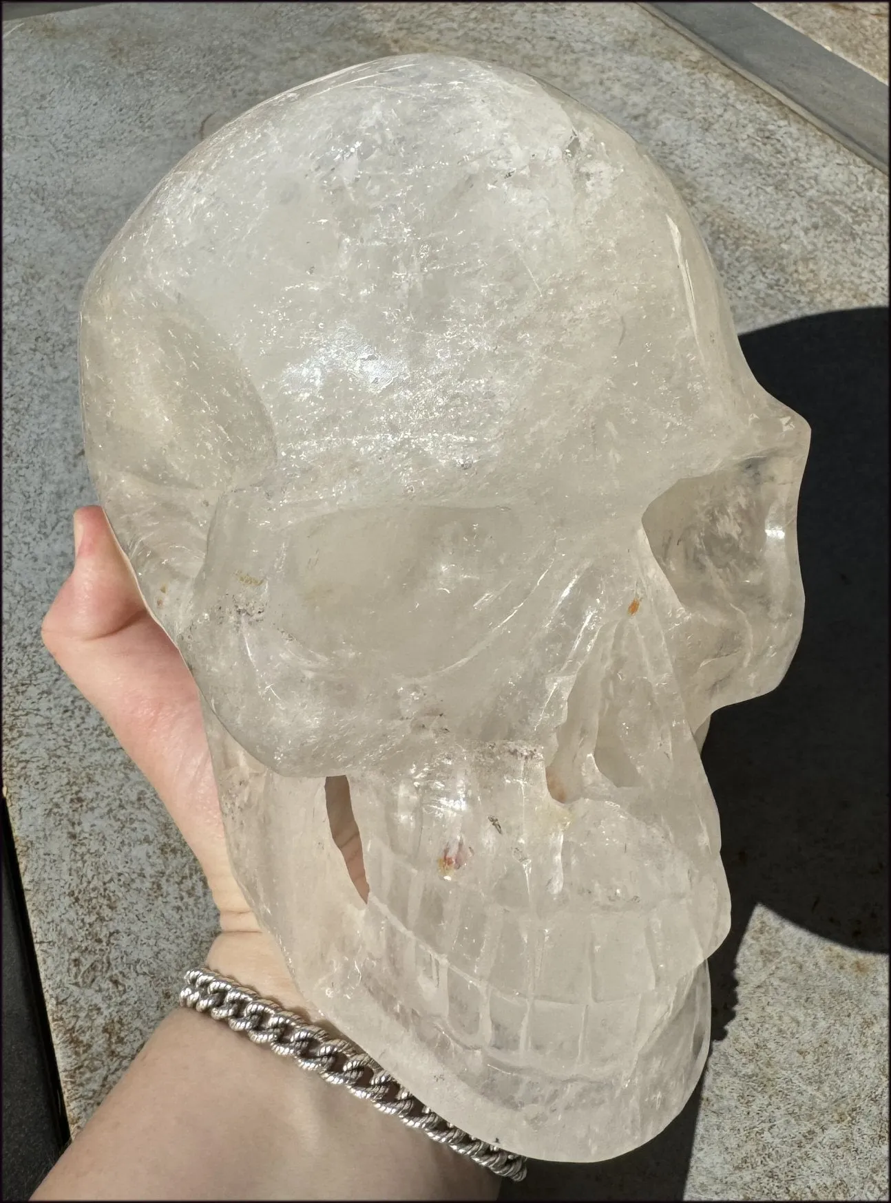 LifeSize Himalayan Quartz Crystal Skull with Crown Chakra Rainbows, Multi-Colored Hematite
