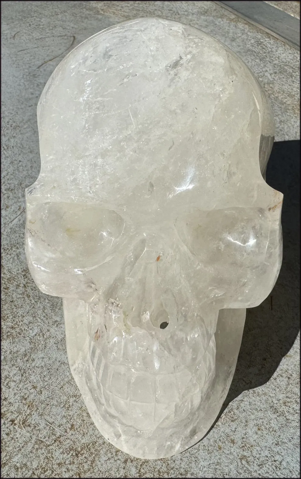 LifeSize Himalayan Quartz Crystal Skull with Crown Chakra Rainbows, Multi-Colored Hematite