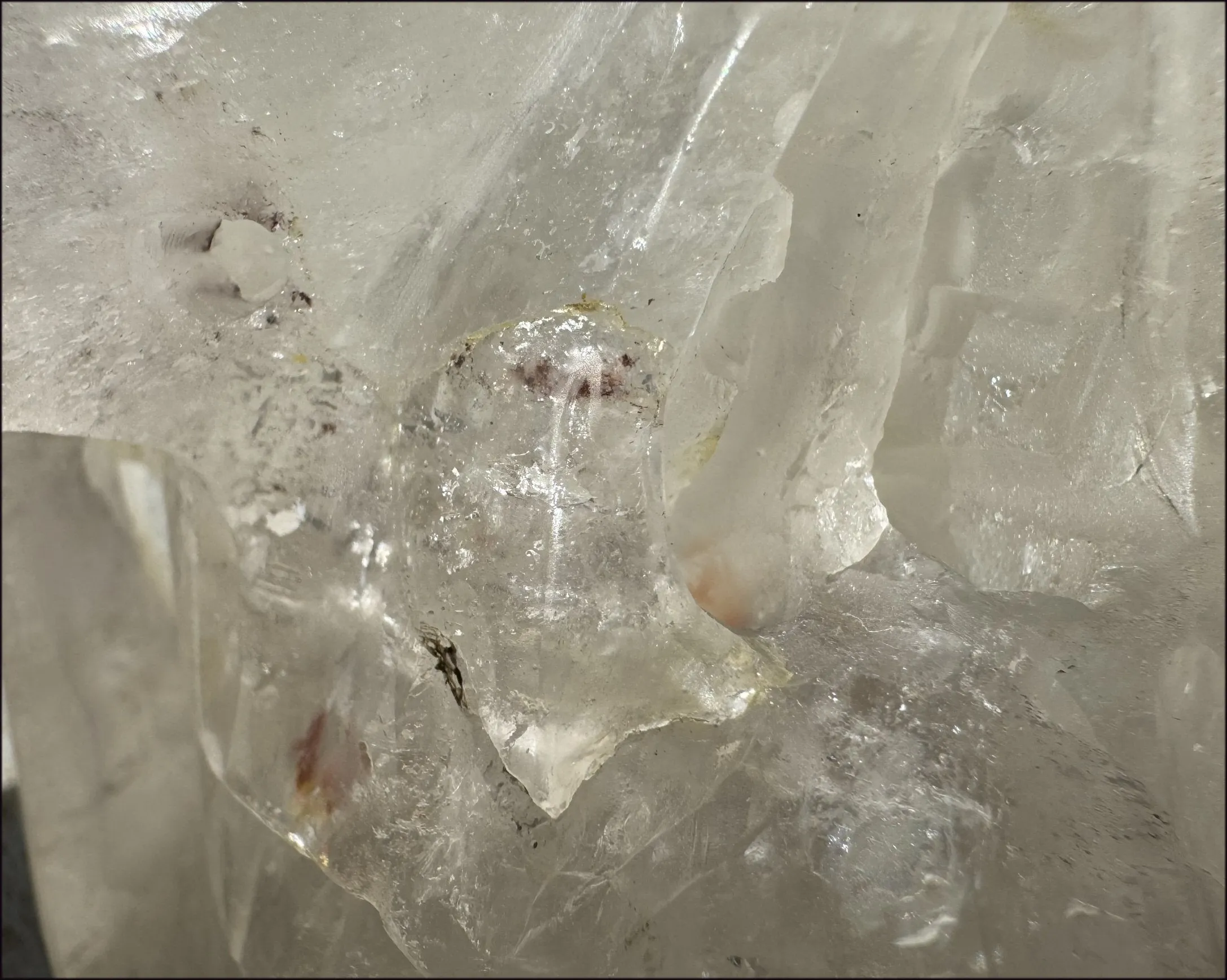 LifeSize Himalayan Quartz Crystal Skull with Crown Chakra Rainbows, Multi-Colored Hematite