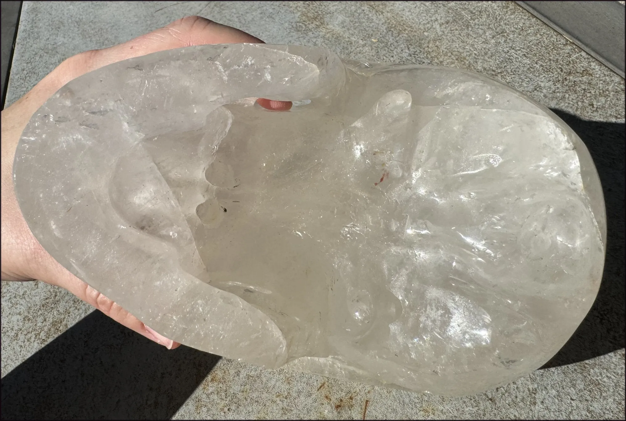 LifeSize Himalayan Quartz Crystal Skull with Crown Chakra Rainbows, Multi-Colored Hematite